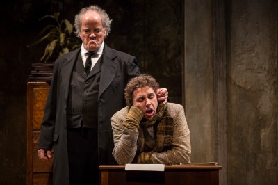 Francis-Guinan-Scrooge-and-Tim-Stoltenberg-Bob-Cratchit-in-The-Second-City’s-Twist-Your-Dickens-Or-Scrooge-You-by-Peter-Gwinn-and-Bobby-Mort-at-Goodman-Theatre.